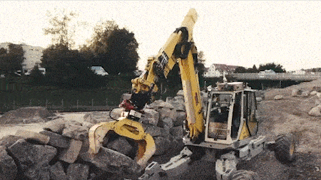 HEAP excavator holding stones and displaying it's sensors.